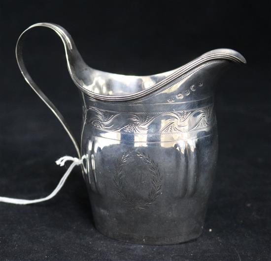 A George III silver cream jug, maker C.D. with London and Newcastle assay marks, no date letter, 124 grams.